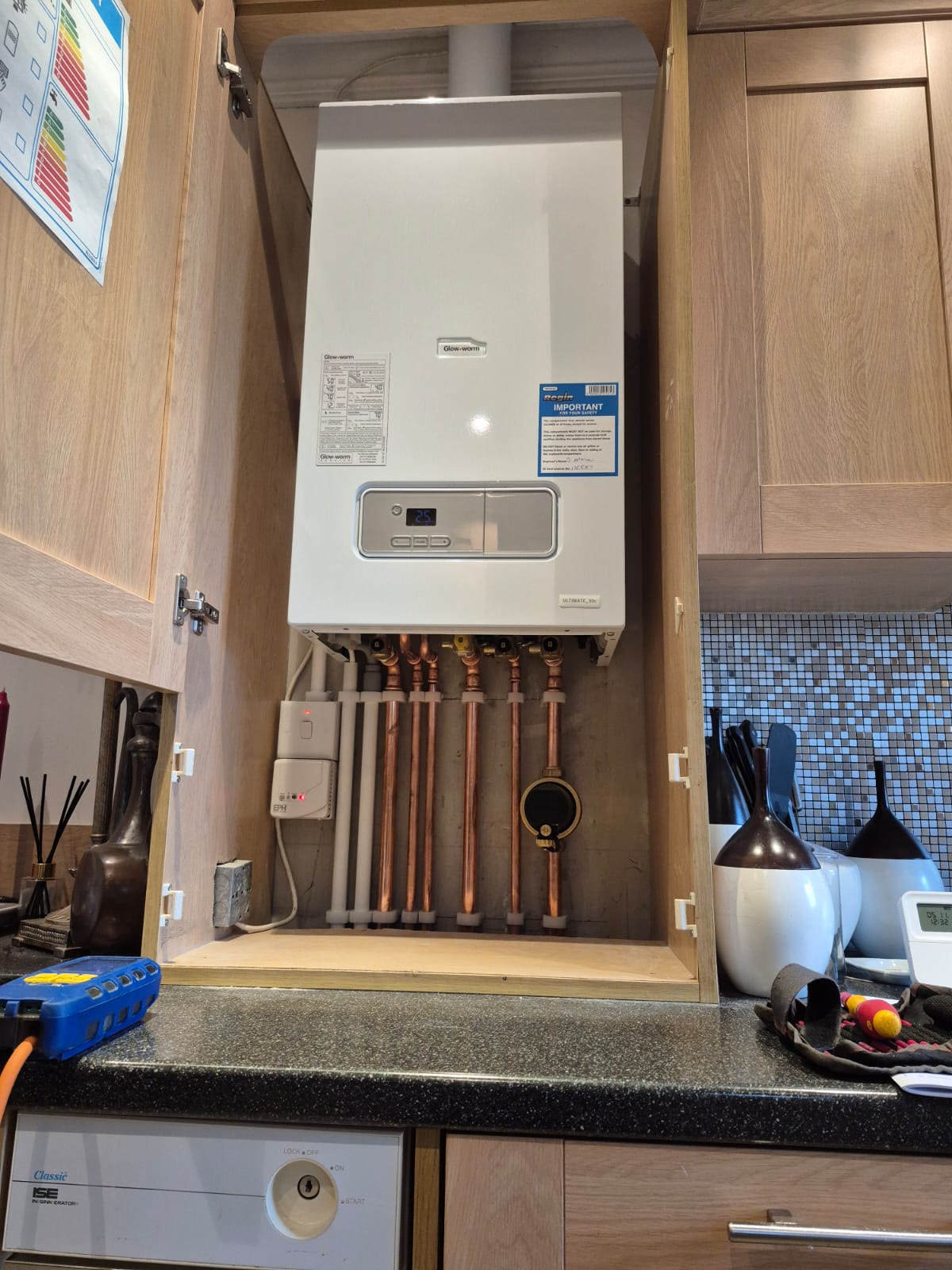 Boiler fitted inside a kitchen cabinet
